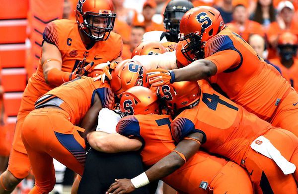 Sep 12, 2015; Syracuse, NY, USA; Syracuse Orange defensive players tackle Wake Forest Demon Deacons flanker Tabari Hines (6) during the second quarter at the Carrier Dome. Mandatory Credit: Rich Barnes-USA TODAY Sports